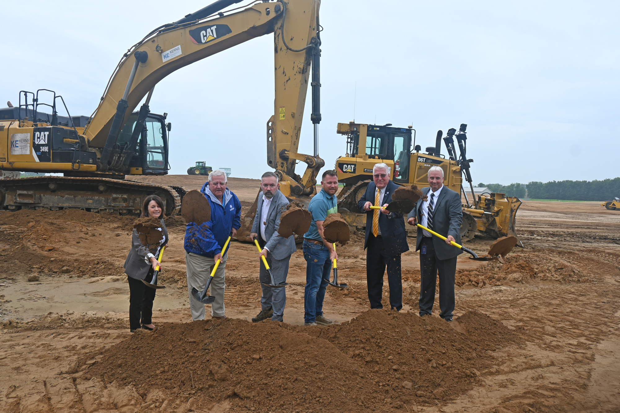 From left to right: Jamie Neal, president of Knox County Chamber of Commerce; Kirk Bouchie, Vincennes Water Utilities manager; Chris Pfaff, CEO of Knox County Indiana Economic Development; Phil Reinbrecht, president of Simplified Developments; Joe Yochum, Vincennes mayor; and Steve Blinn with the Vincennes Redevelopment Commission gather to shovel the first bit of dirt for the groundbreaking ceremony of Bierhaus Flats